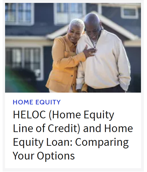A couple hugging in front of a house.