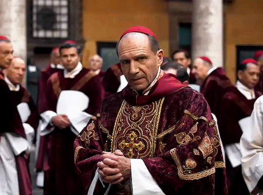 Conclave (2024): Cardinal Lawrence, the lead character, walking amidst other candidates who came for the Pope election.