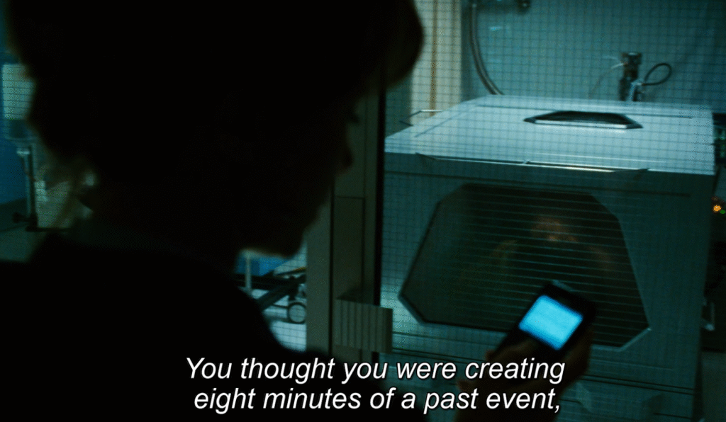 Shot from Source Code (2011): Goodwin looking at Colter's body. 