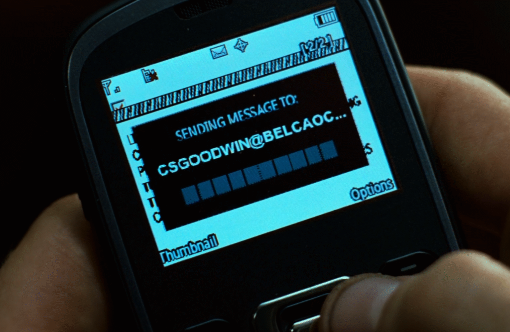 Shot from Source Code (2011): Colter sending an email to Goodwin.